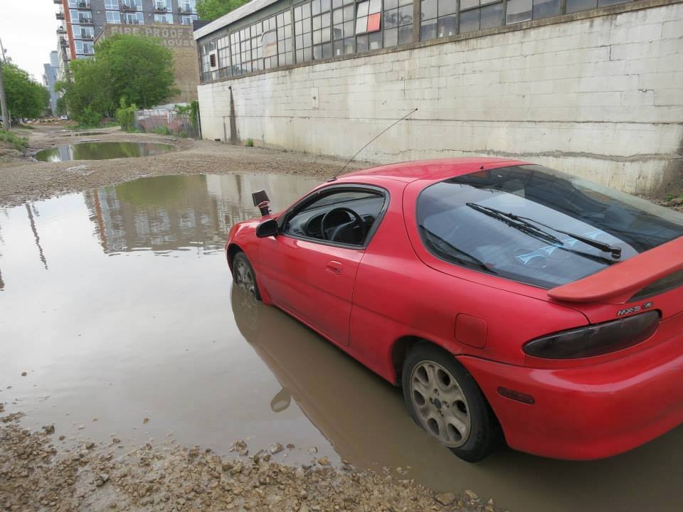 Mazda in Puddle